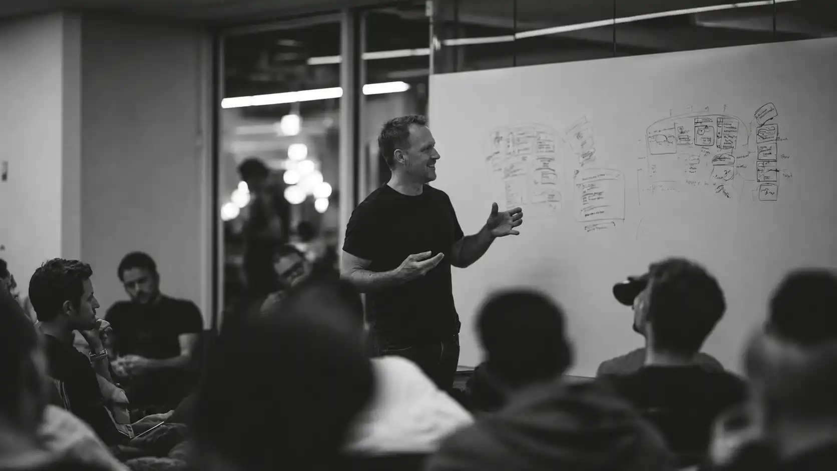A facilitator presenting software concepts during a Development Program workshop